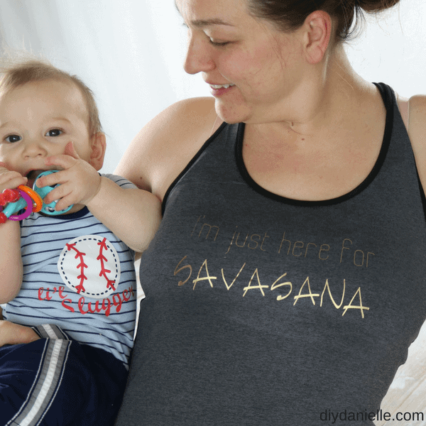 Mom holding baby, wearing a yoga shirt: "I'm just here for Savasana." 