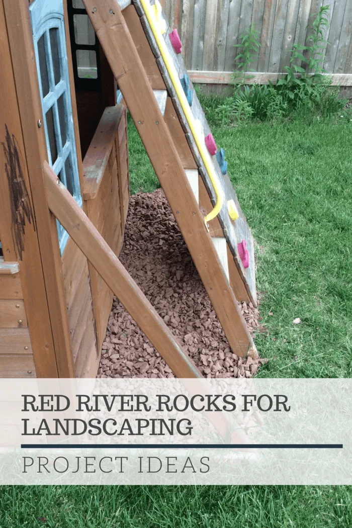 Project ideas for red barn rock. This shows red barn rock as a grass barrier around a swing set.