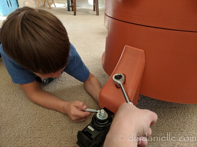 Putting the casters on the Garden Tower 2 with my 6 year old.