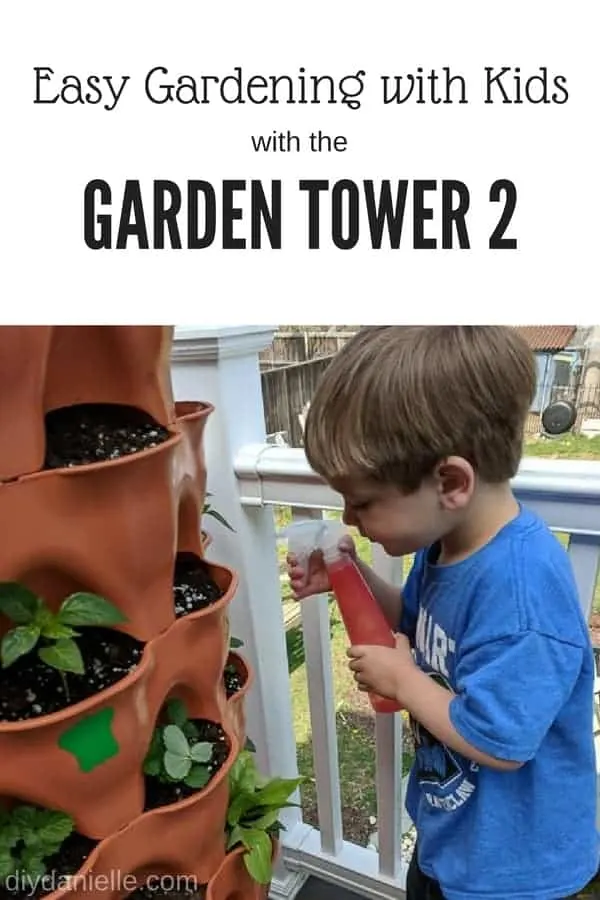 Gardening with kids in the Garden Tower 2. This vertical container garden makes it easy for kids to help with watering and planting. Photo: Child watering his plants.