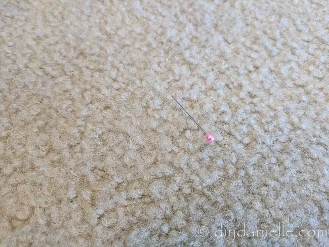 Sewing pin in the carpet- a hazard for both children and adults.