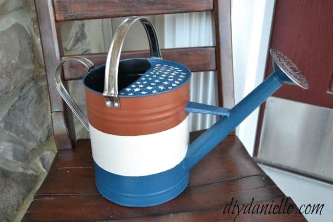How to upcycle a watering can into a patriotic porch decoration.