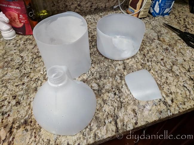 Upcycling the bottom of a vinegar bottle into a litter box for a guinea pig.