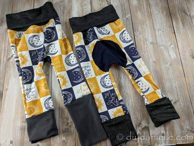Grow with me pants: Maxaloones using dark bands and moon of my life custom fabric from a co-op. 