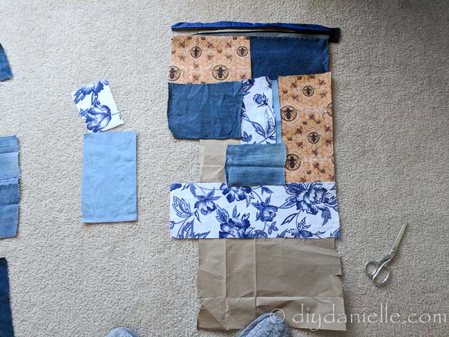 Patchwork pieces of fabric being put together for a DIY hobo bag.