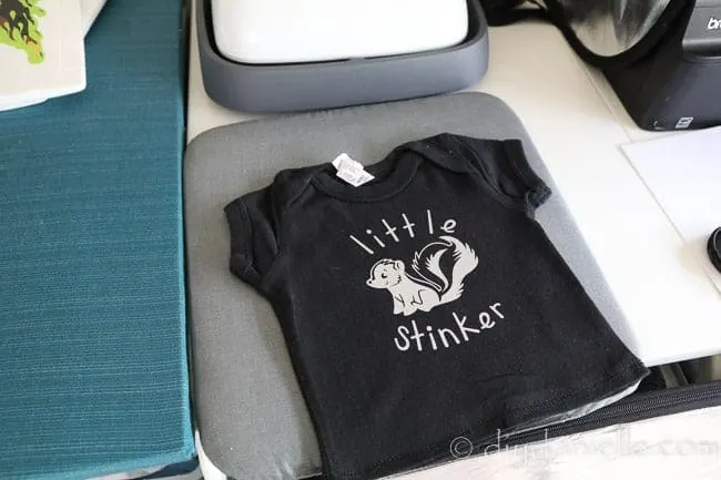 Converted onesie into a t-shirt. I added a heat transfer vinyl decal with my Cricut and EasyPress.