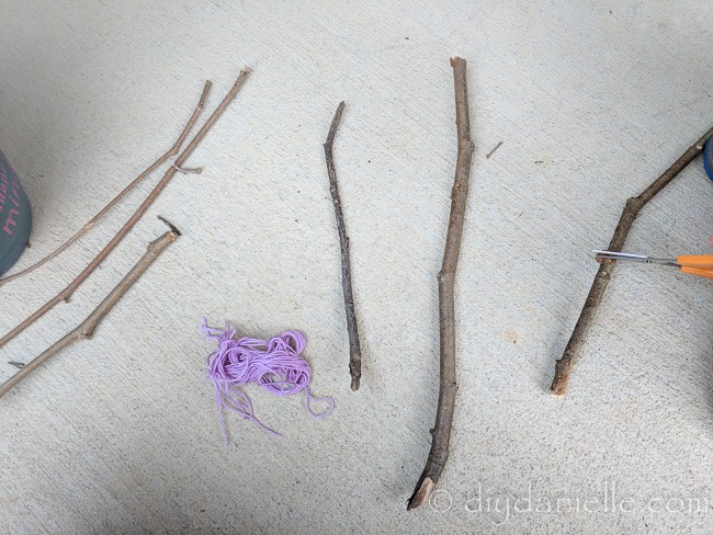 Sticks being used to make a twig trellis.