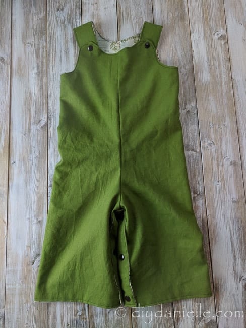 Green side of the Winnie the Pooh reversible romper.