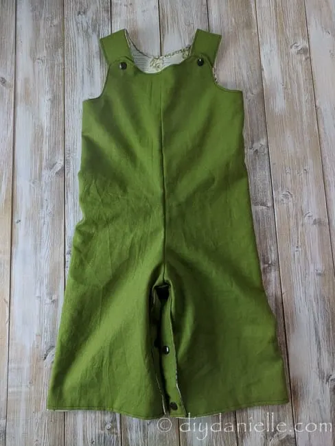 Green side of the Winnie the Pooh reversible romper.