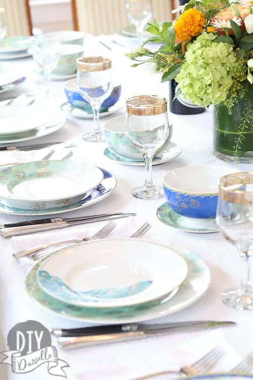 Peacock dishes setup for dinner. Love the colors on the table!