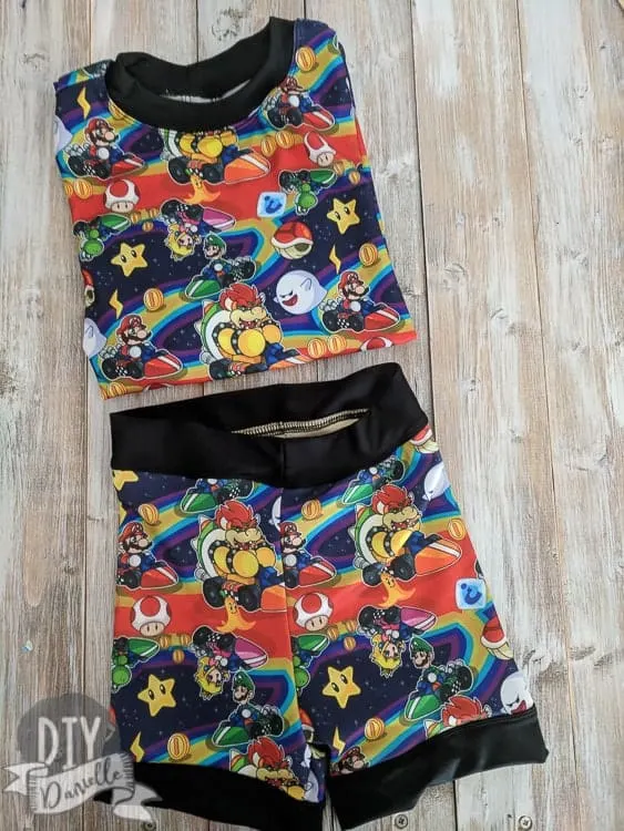 This bathing suit set was made with a rashguard and swimmers pattern. Get my tips and adjustments here. Mario Kart Swim Shorts and Rashguard set.