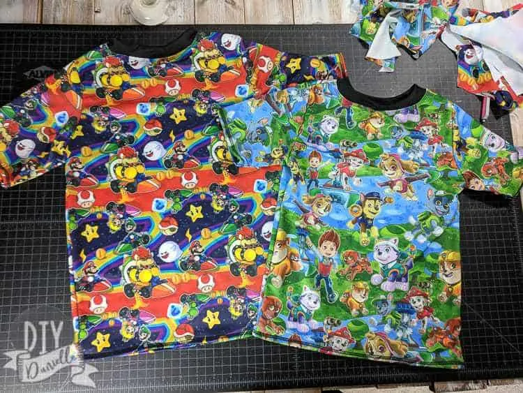 DIY Rashguards with Paw Patrol and Mario Kart fabric. The Rashguard Pattern is Swimmers from Boo! Designs.