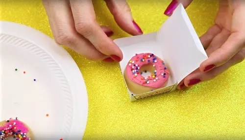 Donut shaped lip balm in tiny donut boxes.
