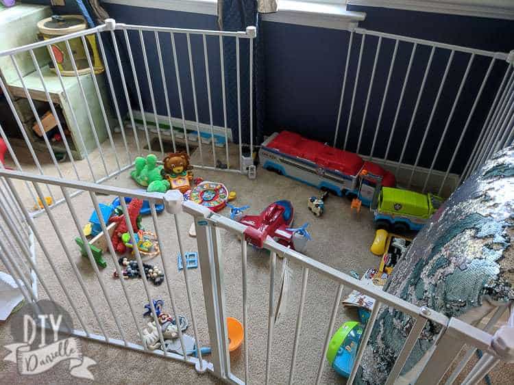 Lots of small toys everywhere in the playpen for the baby.