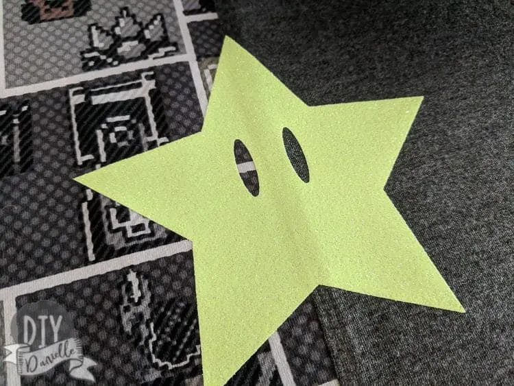 Invincibility star pressed onto a Mario shirt.
