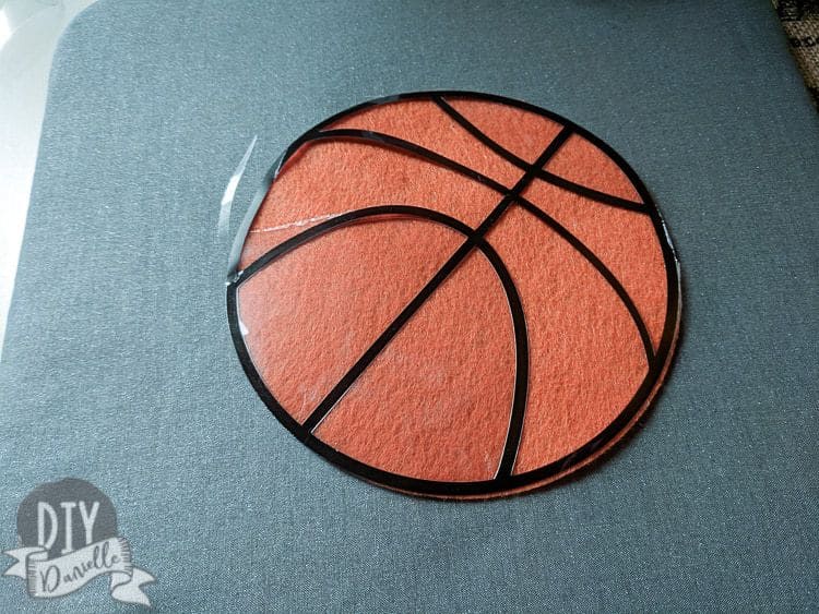Using iron on and felt for a baby basketball shirt.