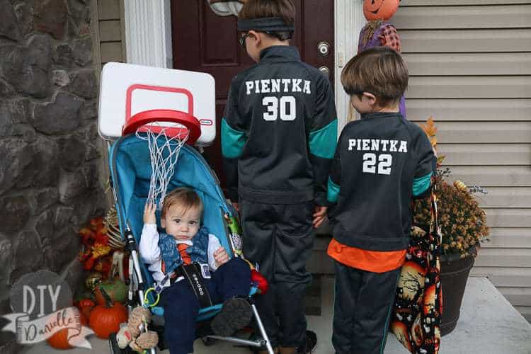 Basketball hoop over the stroller so baby is a basketball for Halloween.