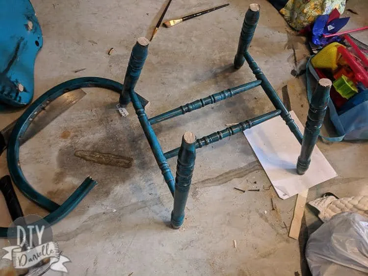 Chair legs with the chair seat cut off.