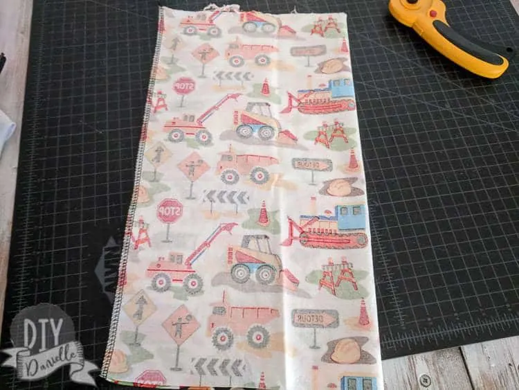 Sew the toy holder along the long edge, right sides together.