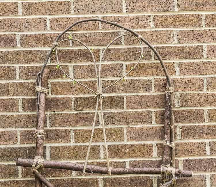 Wood woven into a trellis with a heart in the center.