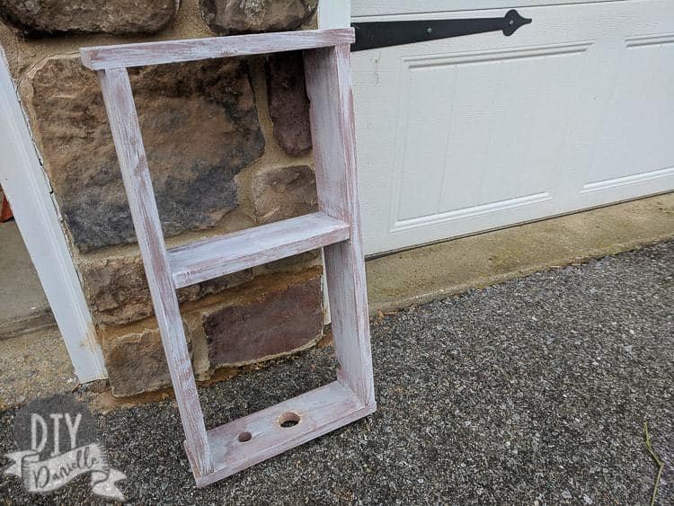 Toothbrush holder with enough room for a charging base on the side. This is pink with dry brushed white on top to create a farmhouse and distressed feel to it.