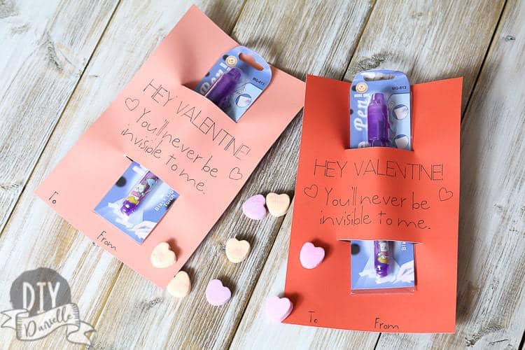 Homemade Valentine cards with an invisible ink pen attached.