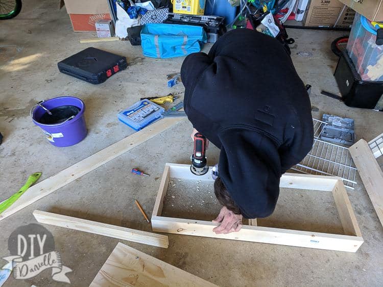 Using a router to create a lip on the frame for the drying rack.