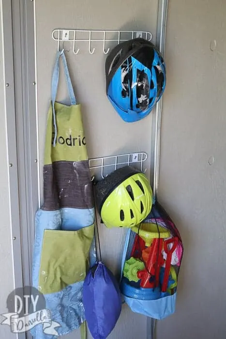 Organizing bike helmets with $1 hooks.