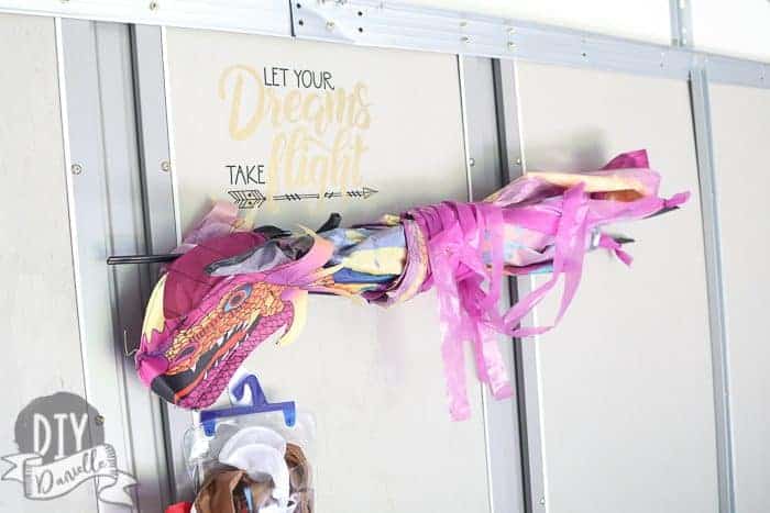 Storing kites on the wall of the kids garage.