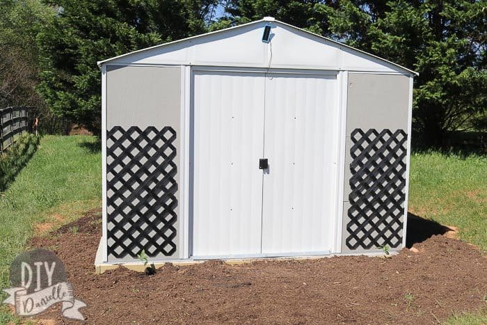 Garage kit with lattice attached to the front. I like the gray shed with the black lattice against it.