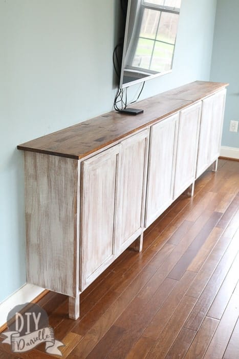 DIY Easy living room storage cabinets. These cabinets are an easy and effective way to add a lot of storage to your living room without purchasing extra furniture.