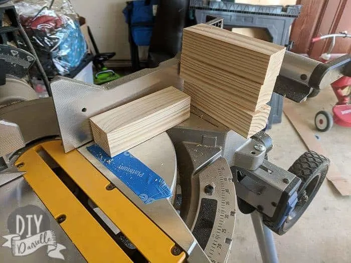 Cutting wood into legs for the cabinets.