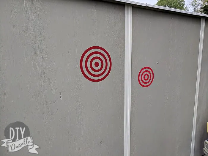 Nerf targets on the side of the shed.