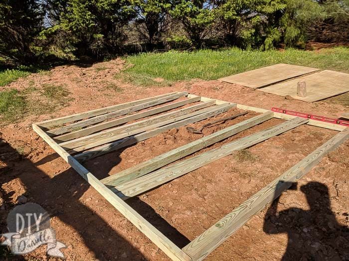 Wood being laid out for the shed base.