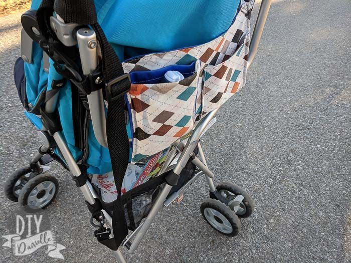 DIY stroller organizer that attaches to the handles on an umbrella stroller.