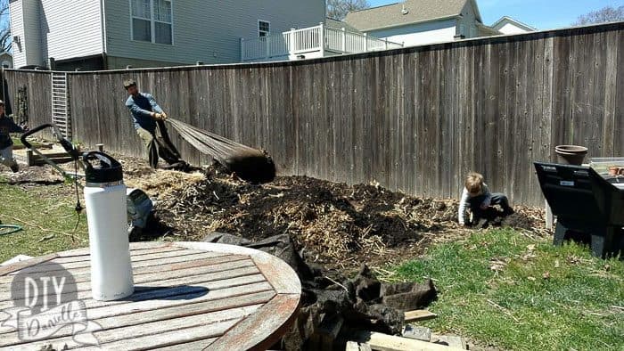 Removing landscape fabric. 