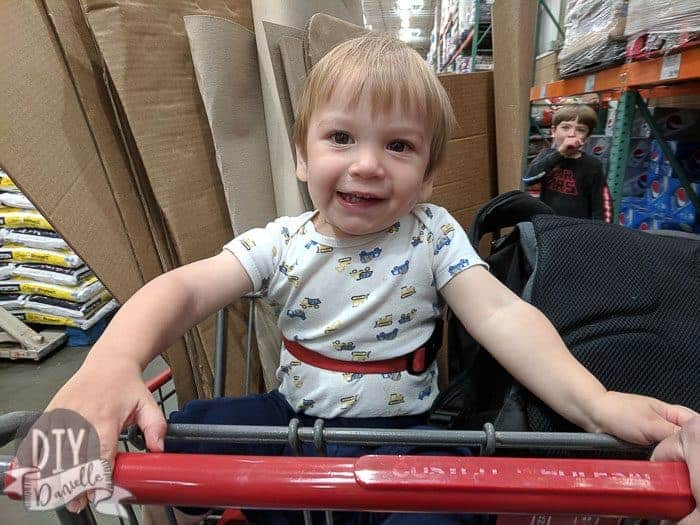 My kids helping wrangle up some cardboard at the store.