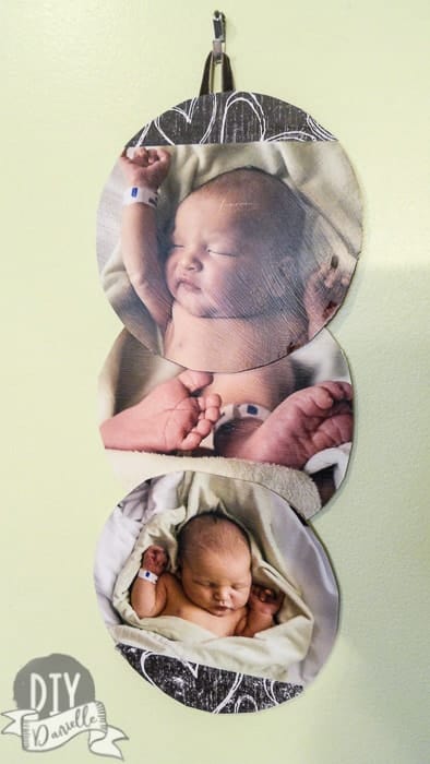 Hanging banner with baby photos. Made from old CDs.