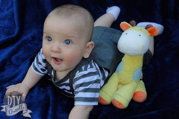 Baby against a blue backdrop.