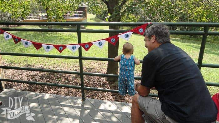 Birthday banner made from fabric in red and white.