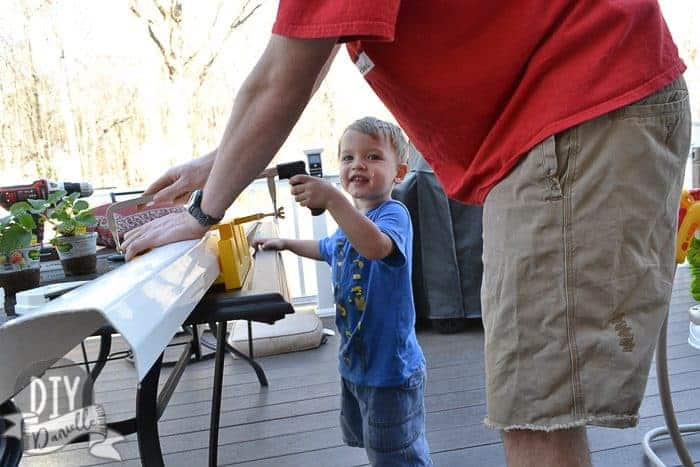 Our son helping daddy cut the gutter.