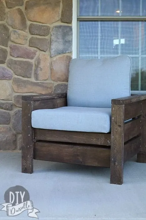 Photo of the wood chairs that I built using Ana White's outdoor chair plan. The gray cushions look fantastic with the cordovan brown stain.