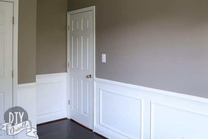 Bedroom photo after: Gray above the chair rail, white from the chair rail to the baseboards.