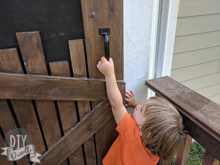 Door handle for screen door. My toddler opening it.