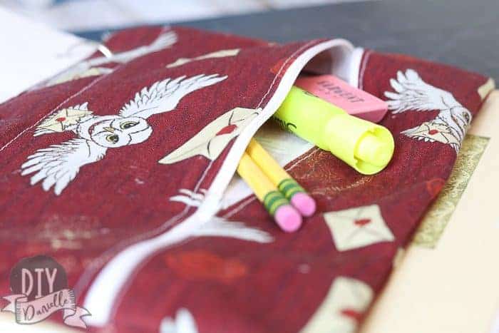 Harry Potter themed DIY Pencil case unzipped with pencils, eraser, and highlighter sticking out.