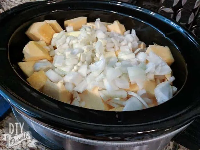 Pumpkin squares, onions, garlic and butter in crockpot