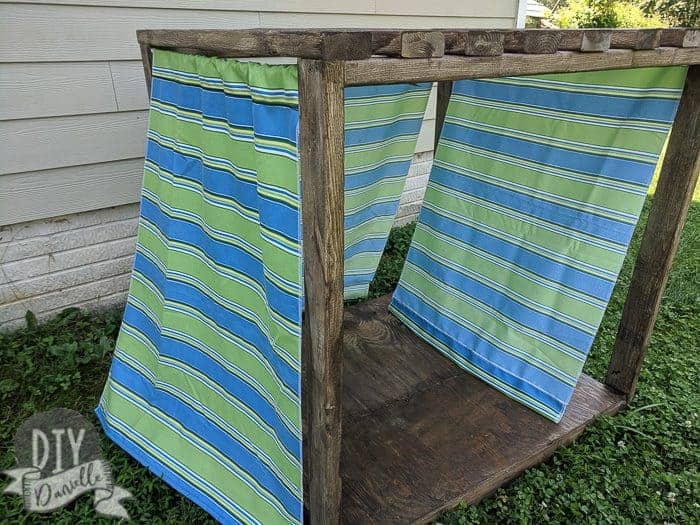 DIY Small Cabana for the backyard for either the kids or the dog, or both. Fabric curtains for the side.