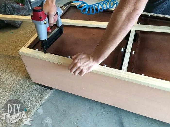 Adding a wood frame around the top of the coffee table.