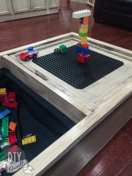 Legos on the storage ottoman/toy chest.