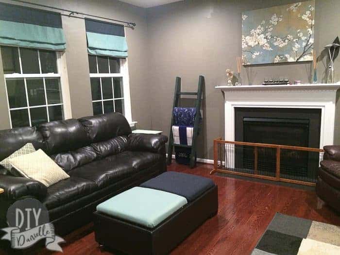 Full photo of the family room with the reupholstered leather ottoman.